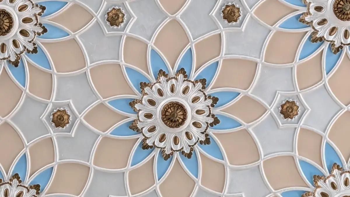 Detailed blue, beige and gold geometric medallion pattern